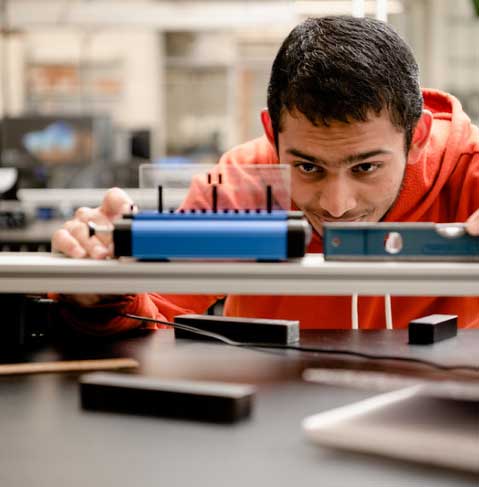 student using leveling tool in lab