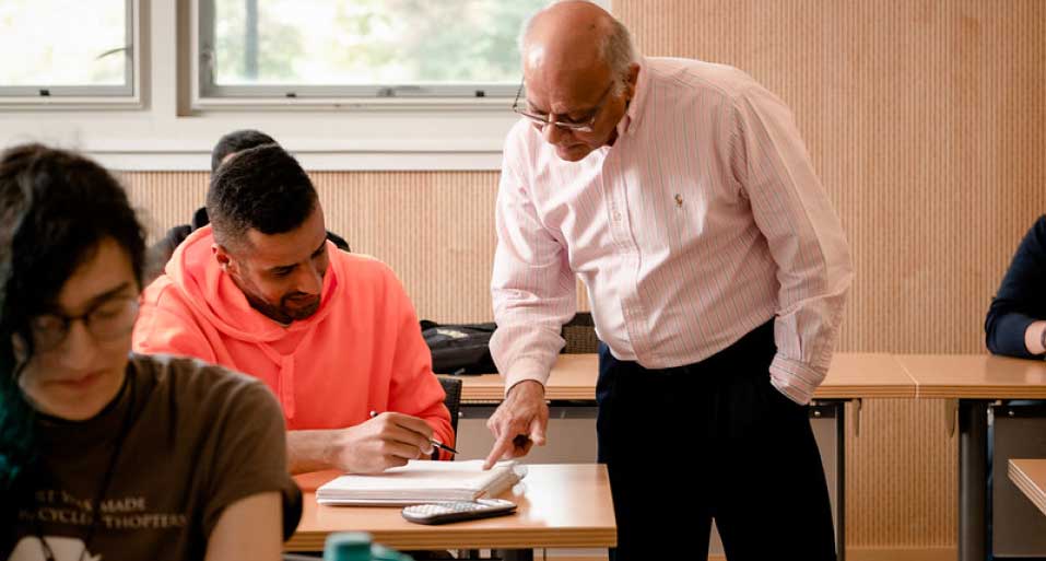 instructor assisting a student in class